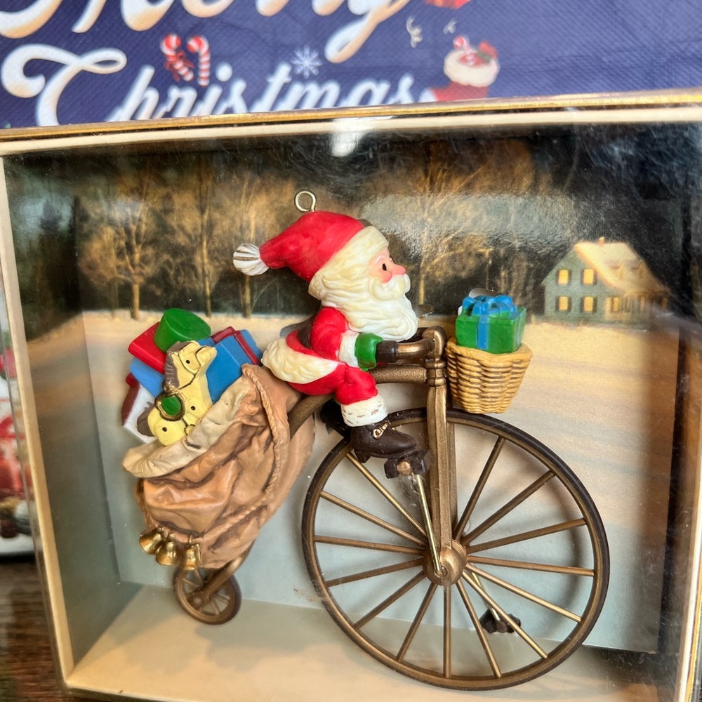 - 1982 Cycling Santa Hallmark Ornament